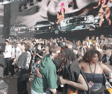 People packed in front of a stage