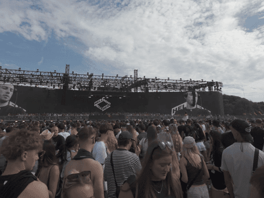 A wide shot of a festival crowd